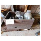 Old wooden box full of old canning jars