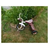 Little red and white bicycle, missing pedal Little red and white bicycle, missing pedal