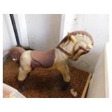 Old small toy horse on wheels