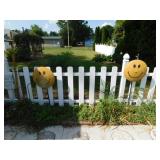 Pair of metal smiley faces on stakes Pair of metal smiley faces on stakes