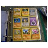 Vintage Pokï¿½mon trading cards in binder