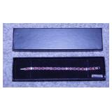 Sterling & garnet bracelet in original box, 7.5"