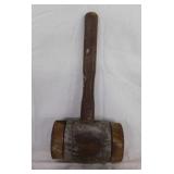 Antique metal banded hand mallet