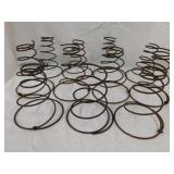 11 antique primitive bed spring coils,