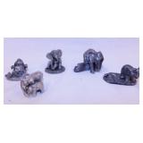 8 elephant figurines: 5 pewter - 2 brass - Candle