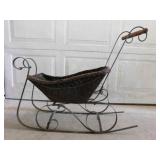 Vintage wrought iron & wicker sleigh, 32" long