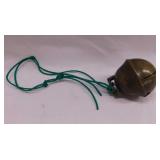 Brass bell on a string