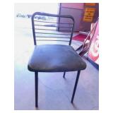 4 green metal folding chairs