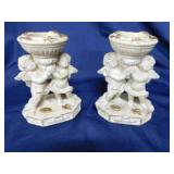 Pair of chalkware cherub candlesticks, 6" tall, a