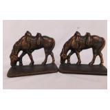 Vintage cast iron? western grazing saddled horse