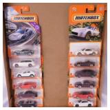 12 Matchbox 1:64 scale diecast cars on card