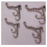 4 vintage painted cast iron hangers