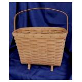 1985 Longaberger footed magazine basket w/ swing