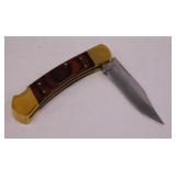 Solid folding hunter knife w/ brass & wood