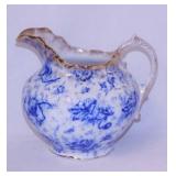 Antique Warwick flow blue pitcher w/ gold trim,