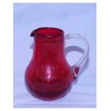 Red crackle glass pitcher w/ applied handle,