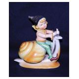 Occupied Japan Pixie Elf riding a snail figurine,