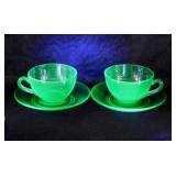 Pair Uranium glass teacups & saucers w/ polished
