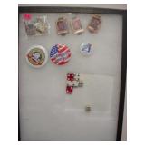 Display case with assorted pins & casino dice