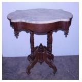 Antique carved walnut parlor table w/ scalloped