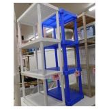 White plastic shelving unit, 4 shelves, 24x12x48