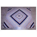 Machine stitched quilt top