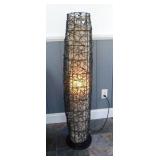 Modern rattan-like swirl uplight floor lamp with
