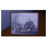 Vintage B&W photo of priest at his office desk,