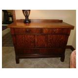 Antique tiger oak buffet on casters,