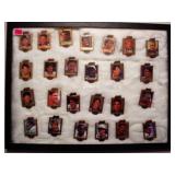 Action packed football star pins in display case,