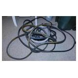 Garden hose in patio planter storage