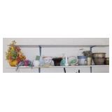 Shelf of planters, vases, floral arrangements