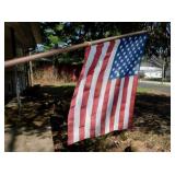 3 American flags on poles