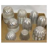 Several vintage aluminum gelatin tart molds,