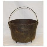 Antique cast iron 3 toed kettle w/ bail handle,