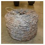 Roll of antique barbed wire fencing