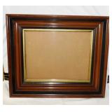 Antique deep walnut frame w/ wavy glass,