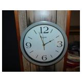 Two Tzumi wall clocks