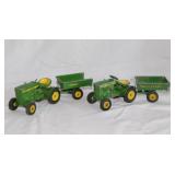 2 Ertl John Deere 110 toy tractors w/ wagons,