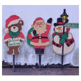11 Christmas outdoor decorations, some lighted
