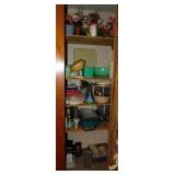 Content of utility closet: Tupperware, jars, pans,