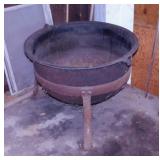 Large cast iron cauldron kettle on tripod stand,