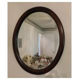 Oval framed beveled wall mirror, 25' x 31'