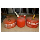 3 gas cans: 2 metal & one plastic