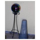 Iridescent glass gazing ball on wrought iron