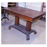 Oak one drawer library table on casters with