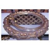 2 oval wall mirrors in gilded ornate frames,