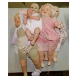 4 antique baby dolls