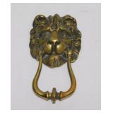 Brass lion head door knocker
