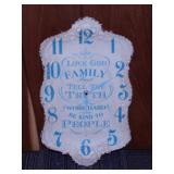 Embossed metal wall clock, 11" x 18"